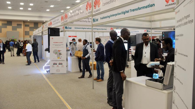 People visit the booth of Huawei during the Kenya Innovation Week 2022 in Nairobi, Kenya, Dec. 6, 2022. (Photo by Charles Onyango/Xinhua)